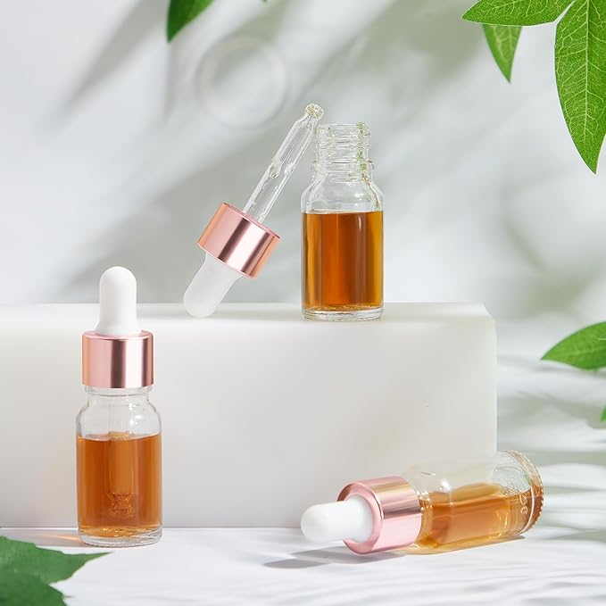 100 Pcs Mini Glass Oil Dropper Bottle Bulk, Clear Essential Small Empty Bottles Sample Containers Perfume Liquid Vials with Cap for Traveling (10 ml,Rose Gold)