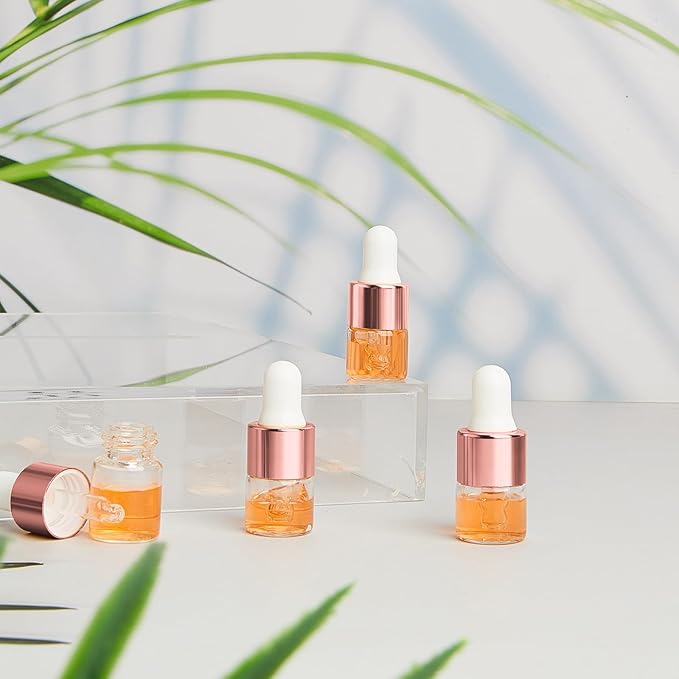 200 Pcs Mini Glass Oil Dropper Bottle Bulk, Clear Essential Small Empty Bottles Sample Containers Perfume Liquid Vials with Cap for Traveling (1 ml,Rose Gold)