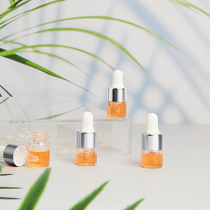 100 Pcs Mini Glass Oil Dropper Bottle Bulk, Clear Essential Small Empty Bottles Sample Containers Perfume Liquid Vials with Cap for Traveling (1 ml,Silver)