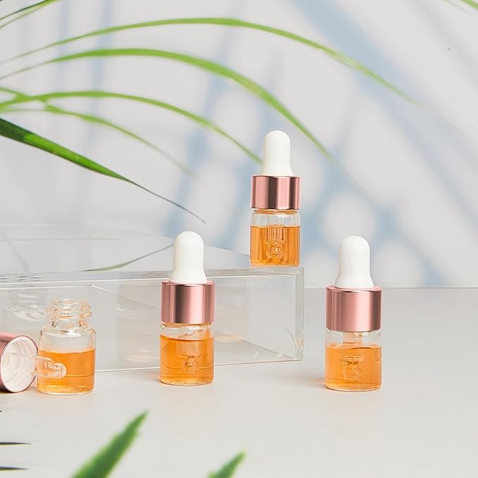100 Pcs Mini Glass Oil Dropper Bottle Bulk, Clear Essential Small Empty Bottles Sample Containers Perfume Liquid Vials with Cap for Traveling (2 ml,Rose Gold)