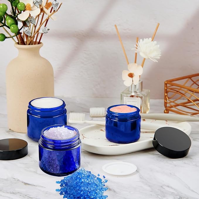 24 Pack 2 oz Round Blue Glass Cosmetic Jars with Inner Liners and Black Lids, Travel Jars, Refillable Containers for Makeup, Cream, Lotion, Sugar Scrubs, Eye Shadow, Slime, Paint, Jewelry