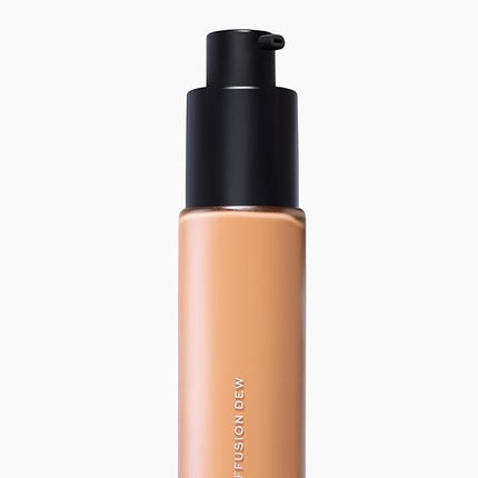 MAKE Beauty Diffusion Dew Skin Tint. Sheer to Medium Coverage Radiant Finish. Blurring, Smoothing, and Brightening for Glowing Complexion. Enhanced with Niacinamide and Adenosine. Amber 10