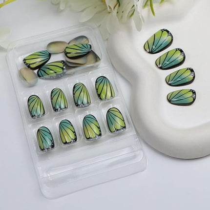 Short Press on Nails Oval Fake Nails with Cute Butterfly Designs Black Nails Press ons Yellow Green Gradient Acrylic Glue on Nail Spring Summer for Women 24 Pcs