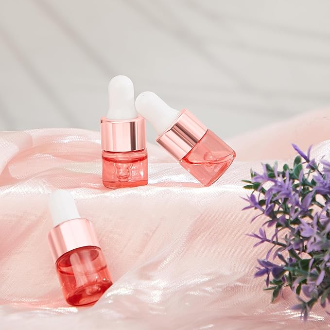100 Pcs Mini Glass Oil Dropper Bottle Bulk, Clear Essential Small Empty Bottles Sample Containers Perfume Liquid Vials with Cap for Traveling (1 ml,Pink Body)