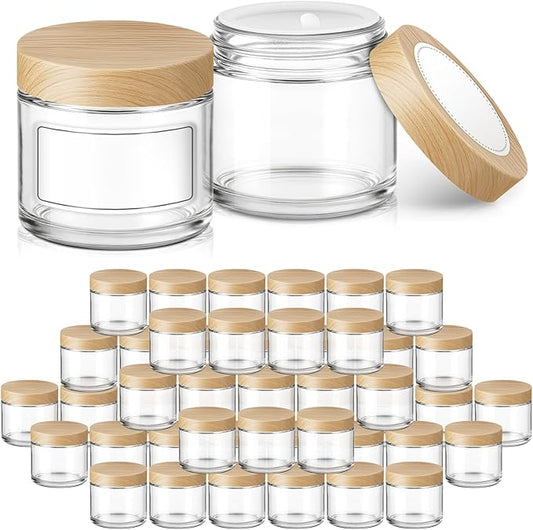 2 oz Glass Jars with Plastic Woodgrain Lids, Bumobum 48 pack Round Clear Cream Jars with Black and White Labels & Inner Liners, Empty Cosmetic Containers for Cream, Lotion, Ointment
