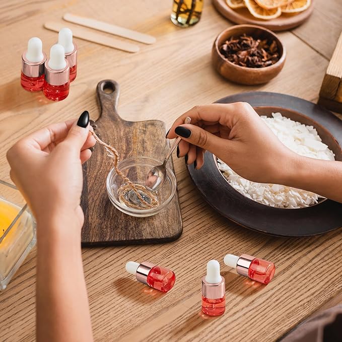 100 Pcs Mini Glass Oil Dropper Bottle Bulk, Clear Essential Small Empty Bottles Sample Containers Perfume Liquid Vials with Cap for Traveling (1 ml,Pink Body)