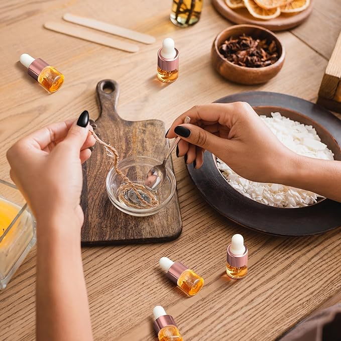 100 Pcs Mini Glass Oil Dropper Bottle Bulk, Clear Essential Small Empty Bottles Sample Containers Perfume Liquid Vials with Cap for Traveling (1 ml,Rose Gold)